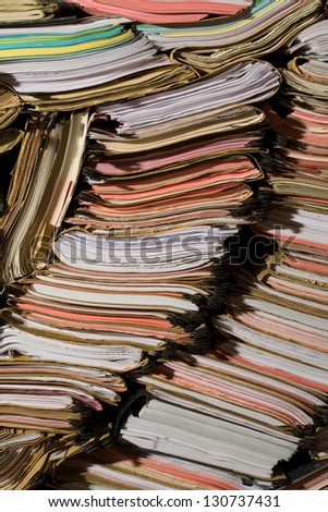 Stack of documents, papers and full binders