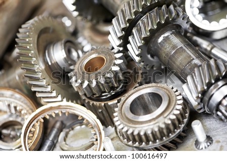 Close-up of automobile engine steel gears and bearings disassembled for repair at car service station