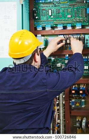 Electrician at safety fuse device replace work at electric power switch line box