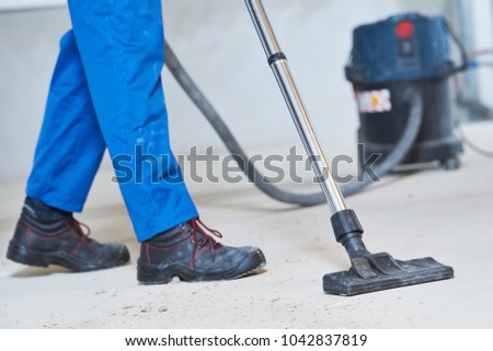 building cleaning service. dust removal with vacuum cleaner
