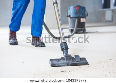 building cleaning service. dust removal with vacuum cleaner