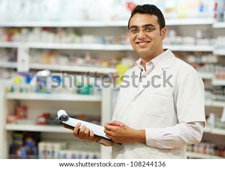 cheerful pharmacist chemist woman standing in pharmacy drugstore cheerful pharmacist chemist woman standing in pharmacy drugstore