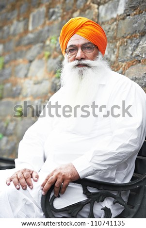 Portrait of Indian sikh man in turban with bushy beard