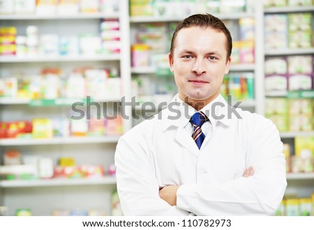 cheerful pharmacist chemist man standing in pharmacy drugstore cheerful pharmacist chemist man standing in pharmacy drugstore