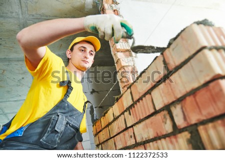 bricklaying. Construction worker building a brick wall