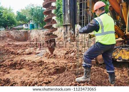 boring holes in ground by drilling rig machine