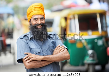 Indian auto rickshaw three-weeler tuk-tuk taxi driver man