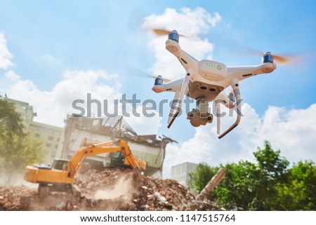 Drone inspecting construction demolition site or building area