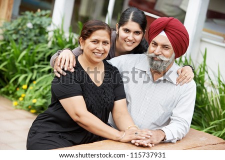 Happy Smiling indian sikh adult people family outdoors Happy Smiling indian sikh adult people family outdoors