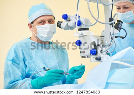 doctor ophthalmologist surgeon in operation room