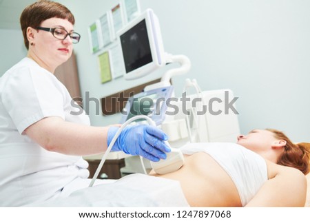 ultrasound scan. Examining stomach of female patient