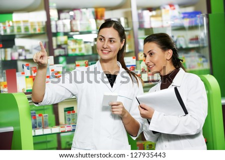 two pharmacist chemist women working in pharmacy drugstore two pharmacist chemist women working in pharmacy drugstore