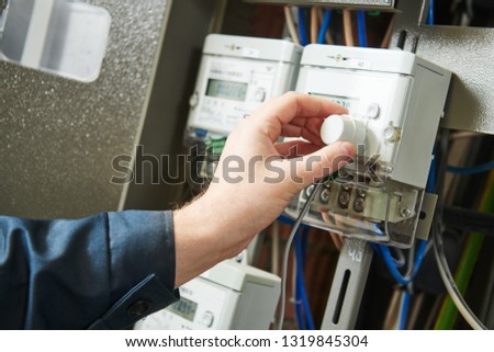 Electricity power control and metering. Worker collects data