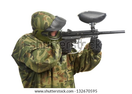 paintball player man in protective camouflage uniform with mask Aiming marker gun over white background
