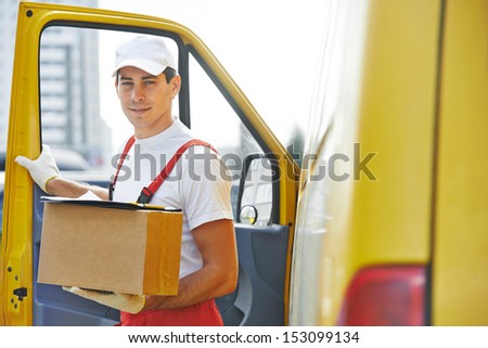 delivery courier man in front of cargo van delivering package carton box