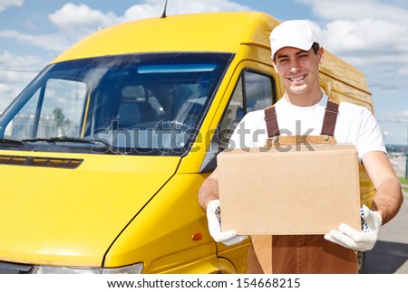 delivery courier man in front of cargo van delivering package parcel carton box