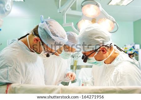 Surgeon Perform Operation On A Patient At Heart Surgery Clinic