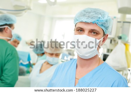 surgeon in uniform after surgery operation at clinic operating room