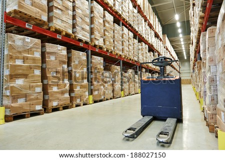 Manual forklift pallet stacker truck equipment at food warehouse