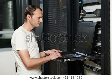 network engineer working in server room