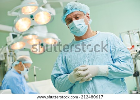 surgeons in uniform perform heart transplantation operation on a patient at cardiac surgery clinic