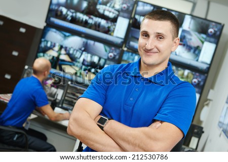 security executive chief in front of video monitoring surveillance security system