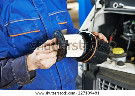 Car servicing, replacing of motor oil or fuel filter