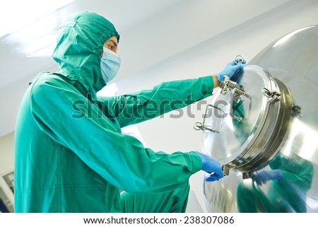 pharmaceutical factory man worker operating mixing machine at pharmacy production industry manufacture factory