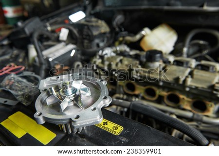 auto repair spare part turbine during automobile car maintenance at engine repair service station garage