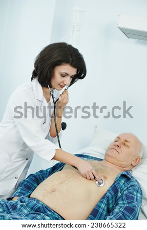 doctor listening heartbeat of patient by phonendoscope in clinic hospital