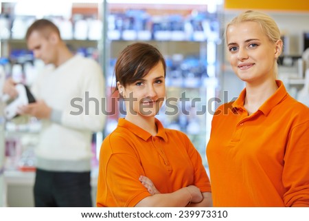 Positive seller or shop assistant portrait  in supermarket store