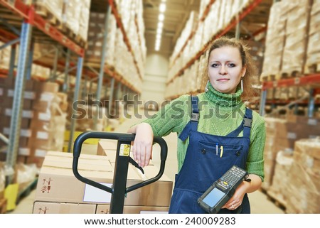 worker in warehouse with bar code scanner