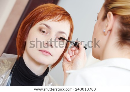 Makeup technique. mascara eyelashes of redheaded woman ?? beauty salon