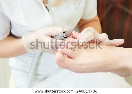 Pedicure technique. Sole treatment during foot care in beauty salon