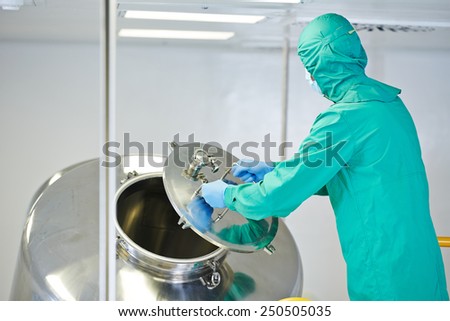 pharmaceutical factory man worker operating mixing machine at pharmacy production industry manufacture factory