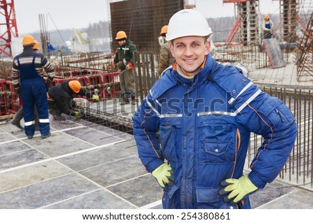 happy construction manager or building site foreman worker