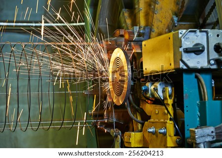 Spot welding machine. Concrete tube reinforcement production at factory