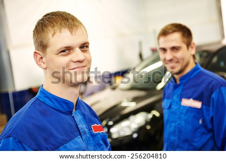 auto repairmenn mechanic portrait in car auto repair or maintenance shop service station
