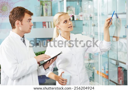 cheerful male pharmacist chemist man portrait in pharmacy drugstore