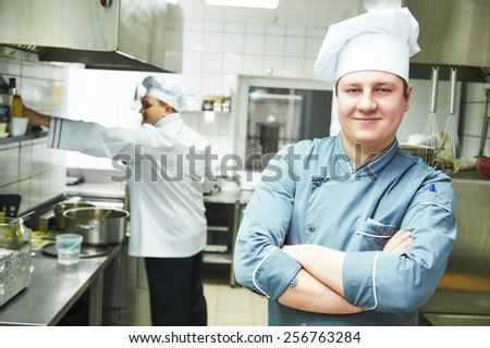 portrait of male cook chef at restaurant kitchen
