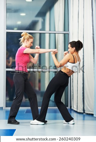 group of woman in gym at fitness physical martial art fighting training exercise in sport wear