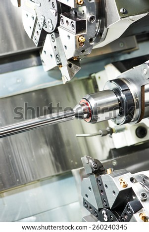 shaft detail turning on metal cutting machine tool at manufacturing factory