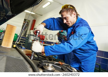 auto repairman industry mechanic worker in car auto repair or maintenance shop service station
