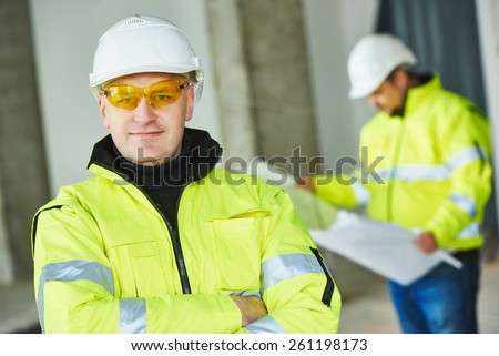 young male construction engeneer worker project manager at a indoors building site