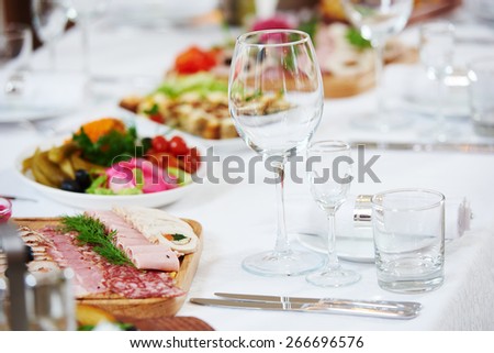 Catering services. Empty glasses set and food in restaurant