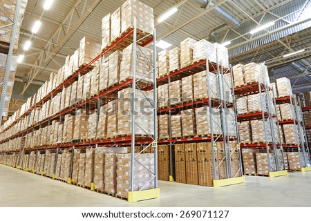 interior of modern warehouse. Rows of shelves with boxes