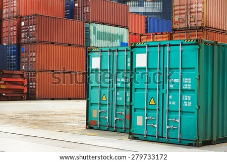Stack of freight container boxes after sorting in warehouse dock terminal of cargo sea port