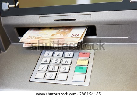 Cash withdrawal. Euro banknotes in ATM