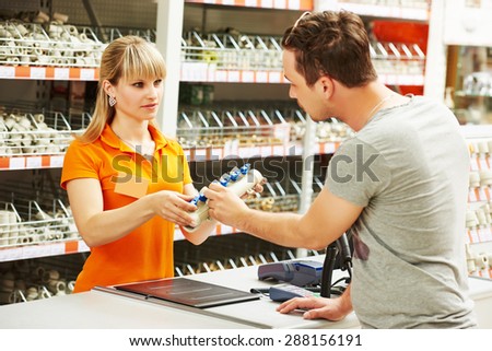 Young woman help purchaser choosing plumber equipment in hardware shopping mall supermarket