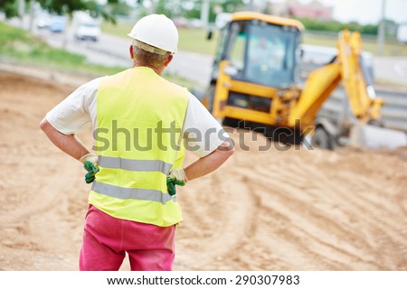 adult construction site manager worker at earthmoving roadwork